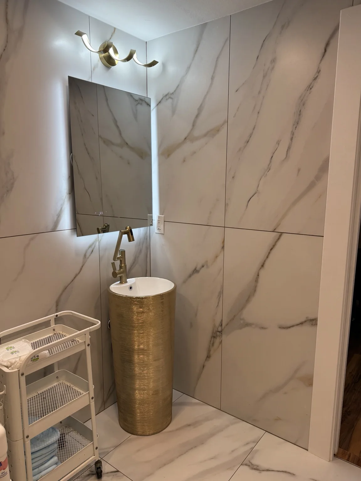 Updated sink and mirror area in the Kirkland bathroom